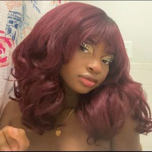 Red synthetic wig with bangs